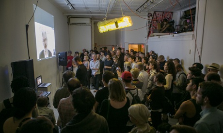 New Yorkers watch, drink beer, as Assange talks about the internet Photograph: OR Books/ Courtney Dudley Photography