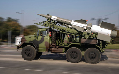 A Serbian army truck carries surface-to-air missiles during preparations for a military parade in Belgrade (Reuters)