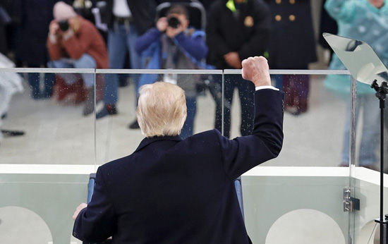 President Donald Trump raises his fist after speaking during the 58th Presidential Inauguration at the U.S. Capitol in Washington on Jan. 20, 2017. Photo: Carolyn Kaster/AP